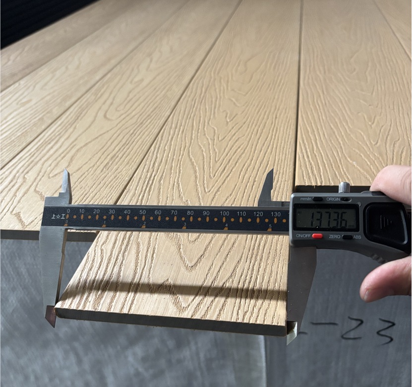 MexyTech wood grain composite decking board measured with caliper