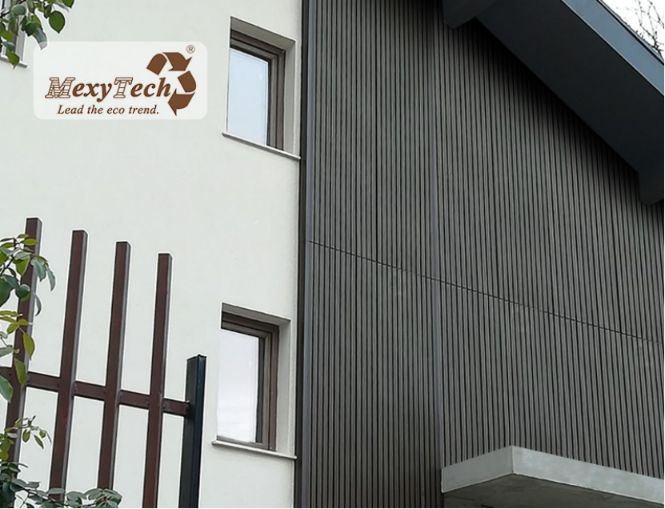 Fire-rated WPC cladding installed on a modern residential facade, showcasing MexyTech’s vertical wood-grain exterior wall panels for non-tile buildings